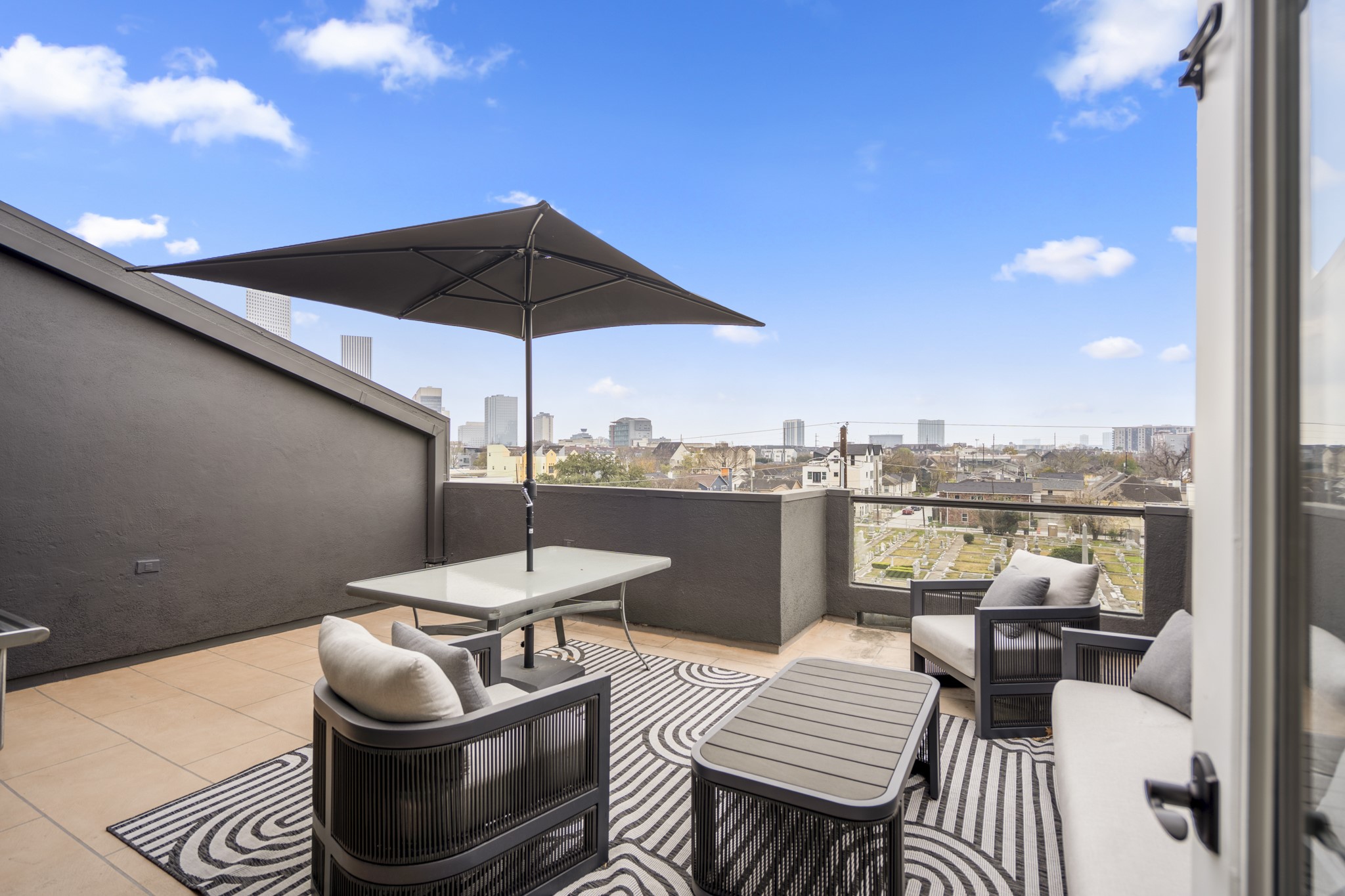 1310 West Dallas Street Houston, TX 77019 - Photo 43 of 50 Rooftop living comes to life on this expansive terrace, designed for relaxing, gathering, and soaking in skyline views. Just off the upper level, it offers a seamless extension of the home and a standout space for everyday moments or entertaining.