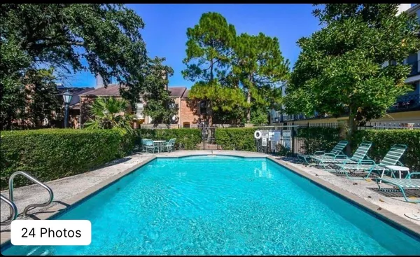 a view of swimming pool with chairs