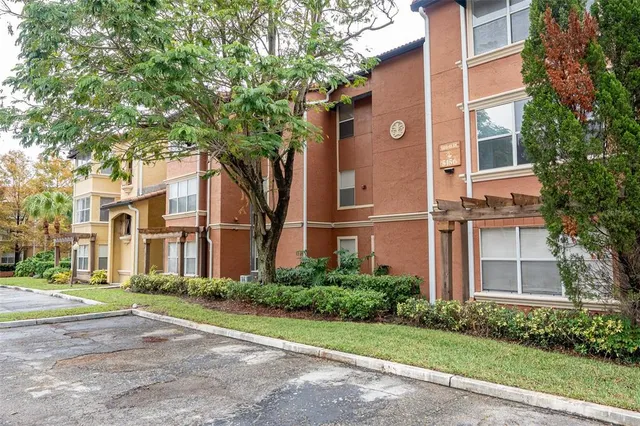 a view of a building with a yard