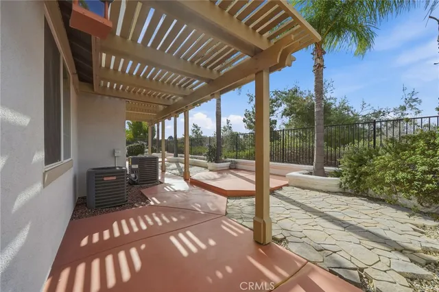 an aerial view of residential houses with outdoor space and lake view