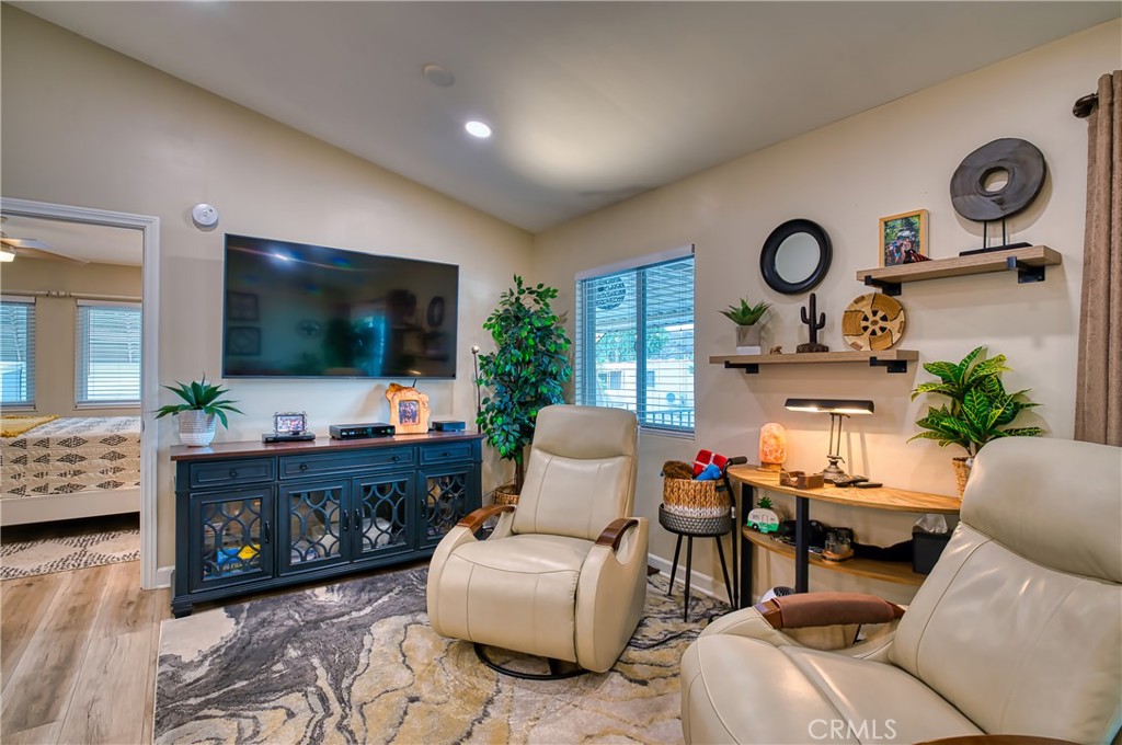 2054 Parker Dam Road, Unit E8 Earp, CA 92242 - Photo 13 of 75 a living room with furniture and a flat screen tv