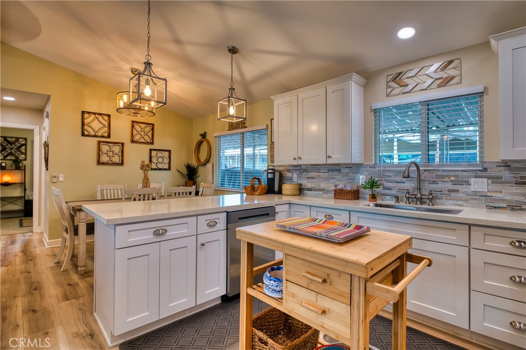 2054 Parker Dam Road, Unit E8 Earp, CA 92242 - Photo 19 of 75 a kitchen with a stove a sink dishwasher and a refrigerator with wooden floor