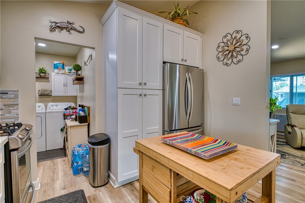 2054 Parker Dam Road, Unit E8 Earp, CA 92242 - Photo 22 of 75 a room with kitchen island a table and chairs