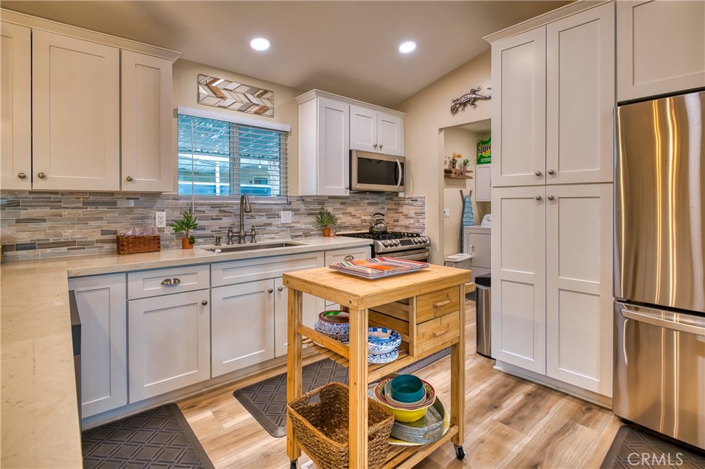 2054 Parker Dam Road, Unit E8 Earp, CA 92242 - Photo 23 of 75 a kitchen with a stove a refrigerator and a sink