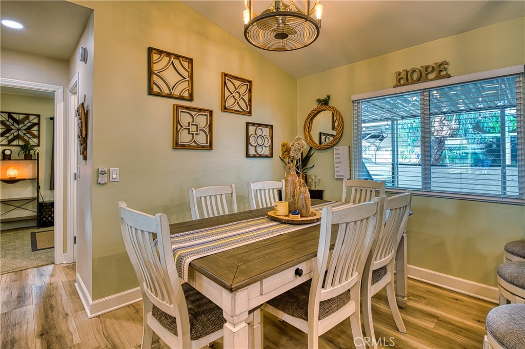 2054 Parker Dam Road, Unit E8 Earp, CA 92242 - Photo 24 of 75 a view of a dining room with furniture wooden floor and a chandelier