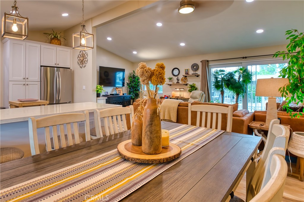 2054 Parker Dam Road, Unit E8 Earp, CA 92242 - Photo 28 of 75 a view of a dining room with furniture a chandelier and wooden floor
