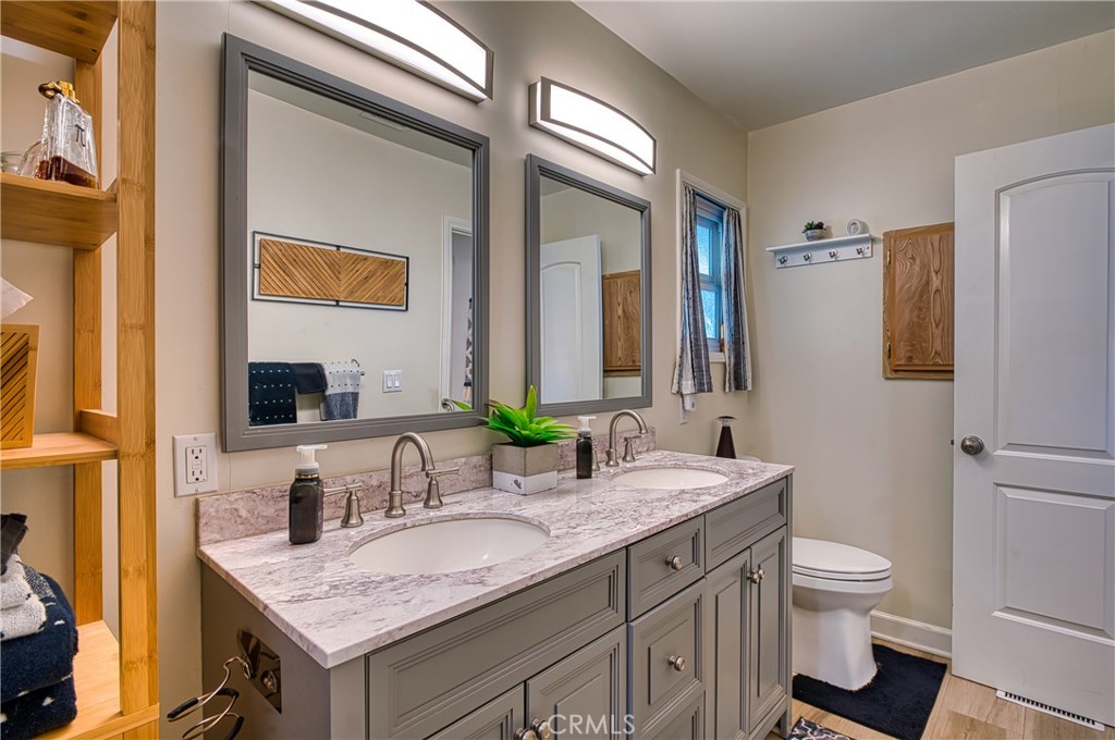 2054 Parker Dam Road, Unit E8 Earp, CA 92242 - Photo 41 of 75 a bathroom with a granite countertop sink and a mirror