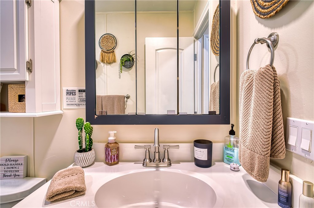 2054 Parker Dam Road, Unit E8 Earp, CA 92242 - Photo 51 of 75 a bedroom with a bed a potted plant on dresser and a window