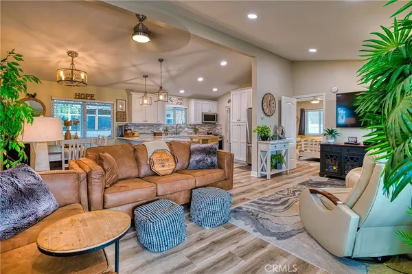 a living room with fireplace furniture and a flat screen tv