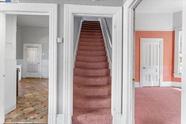 a view of a kitchen with sink and stove