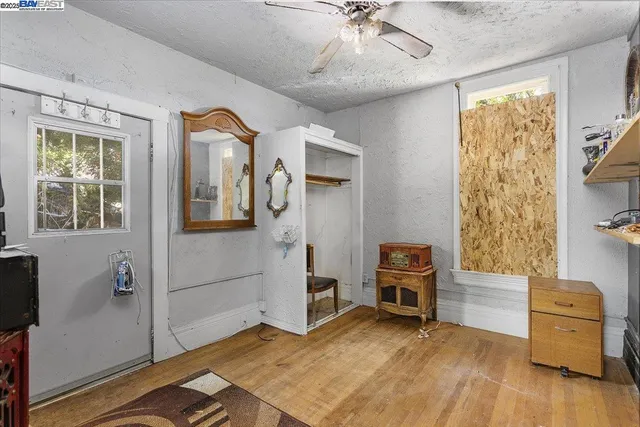 a view of room with furniture and wooden floor