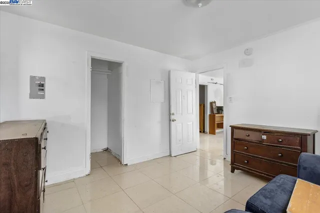 a backyard of a house with barbeque oven and glass windows