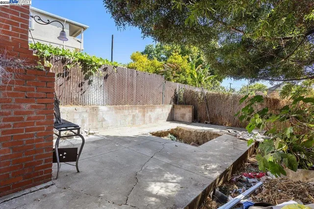 an aerial view of a city with lots of residential buildings and parking space