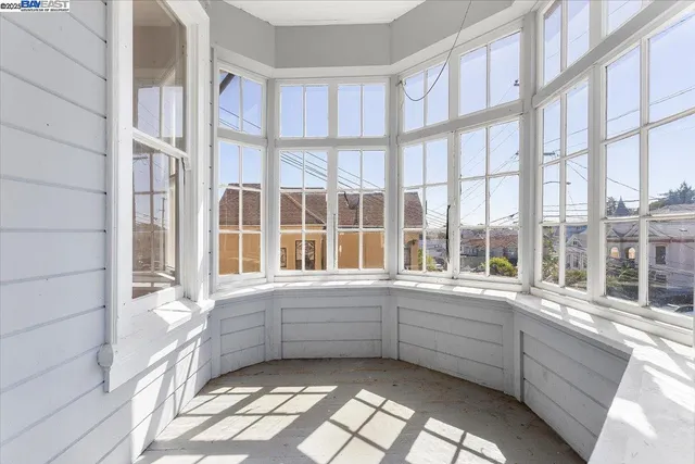a view of building with a window and balcony