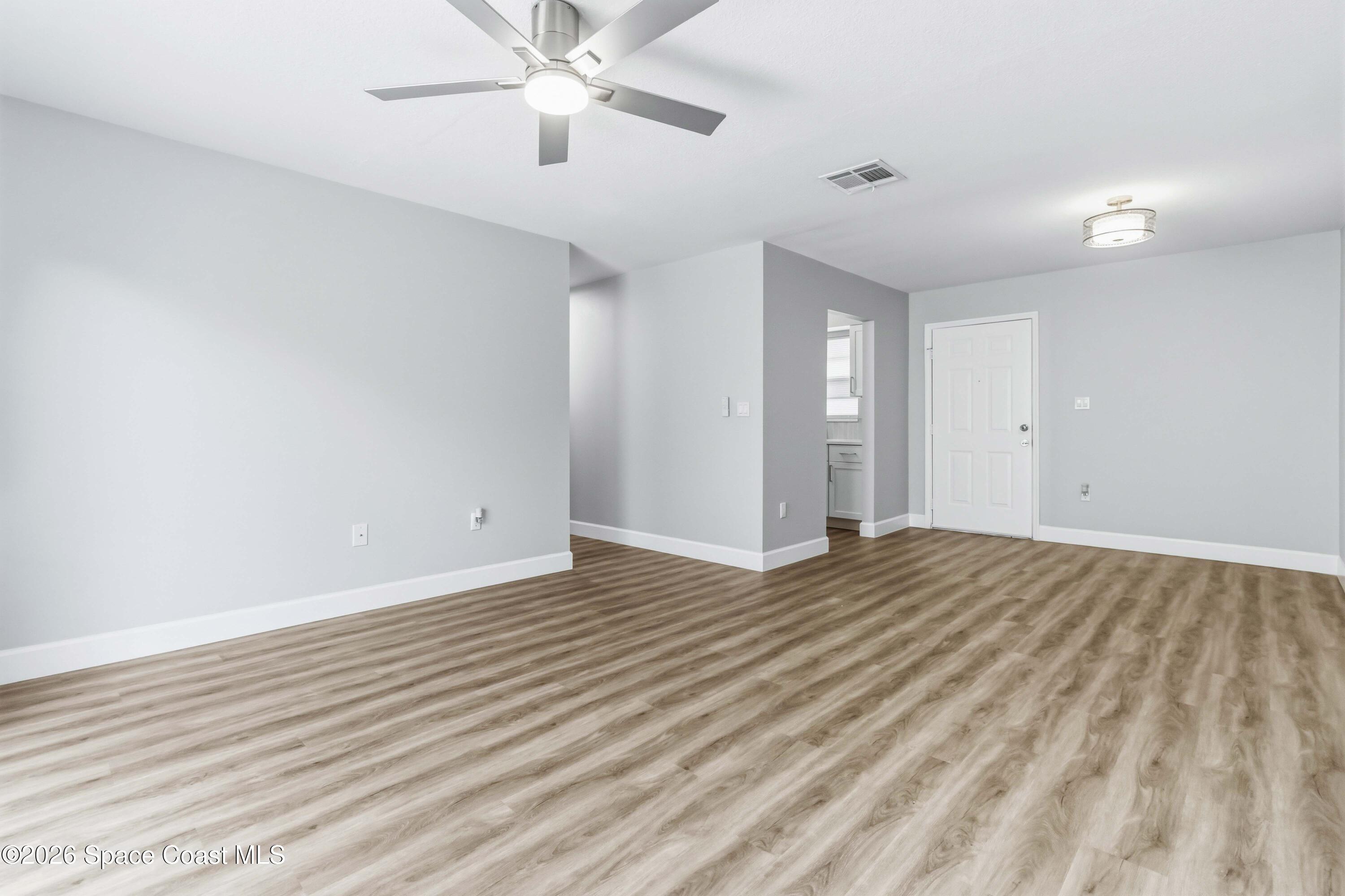 2258 Flower Tree Circle Melbourne, FL 32935 - Photo 15 of 30 wooden floor in an empty room