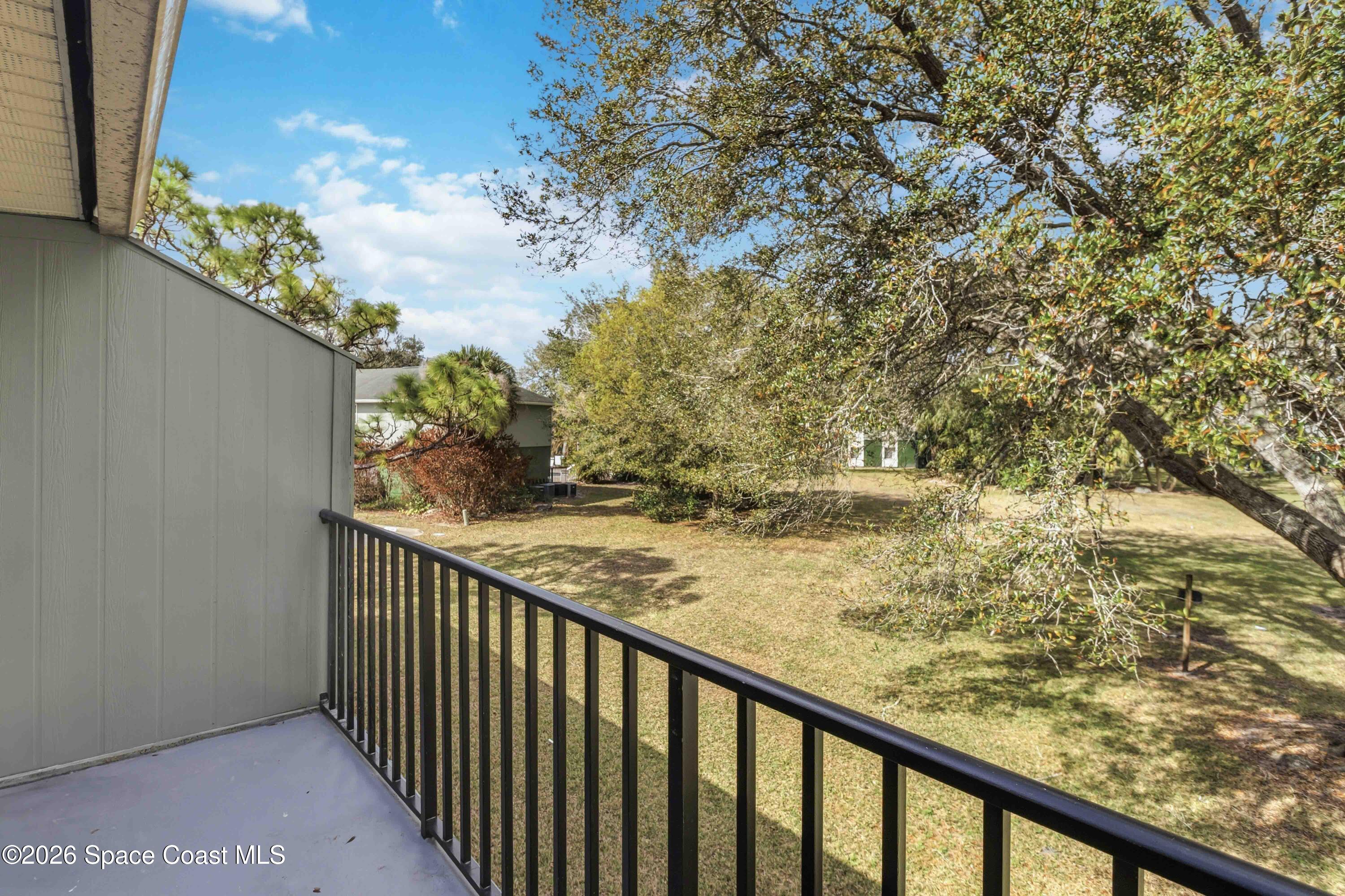 2258 Flower Tree Circle Melbourne, FL 32935 - Photo 24 of 30 a view of a balcony with an outdoor space