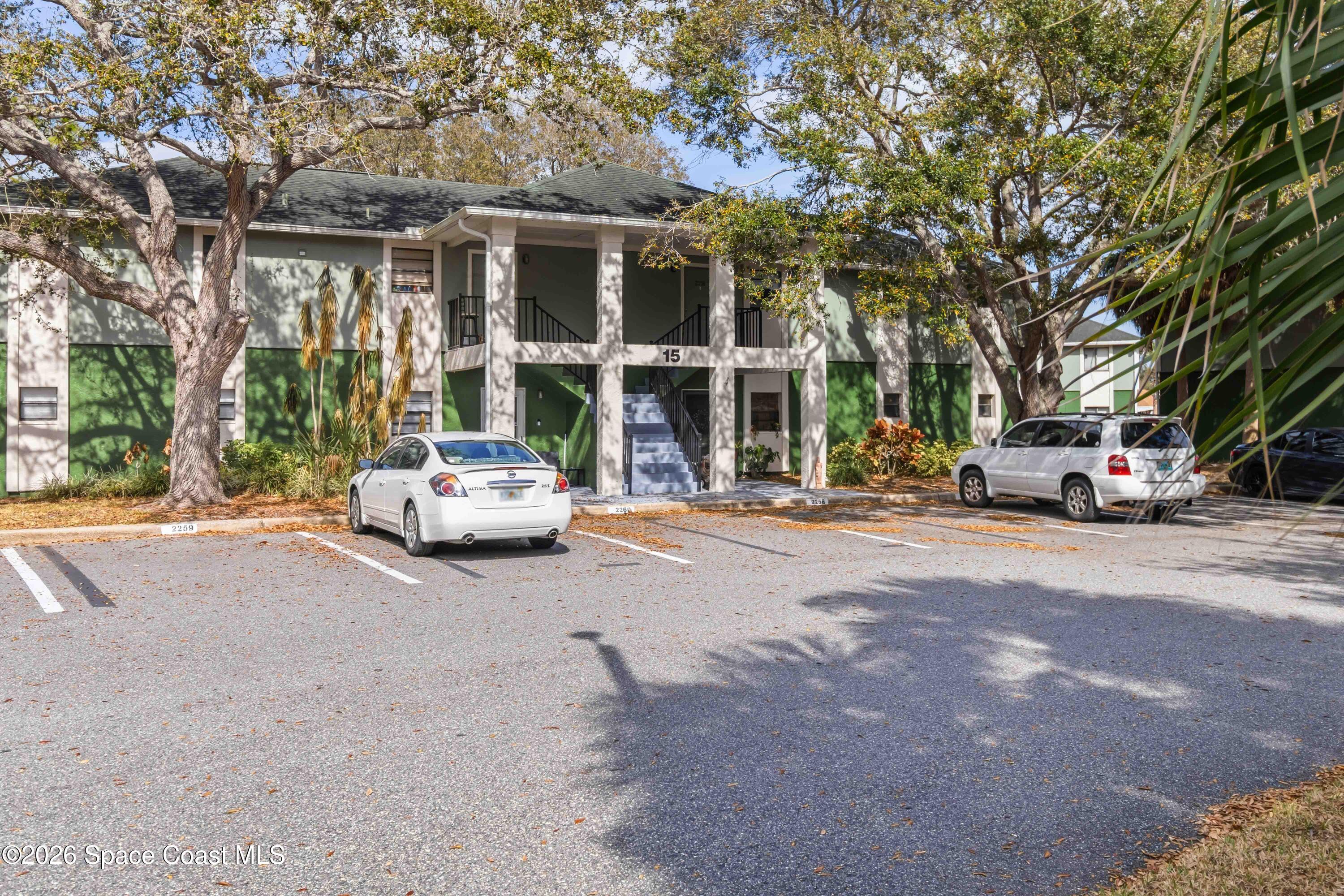 2258 Flower Tree Circle Melbourne, FL 32935 - Photo 30 of 30 a car parked in front of a building