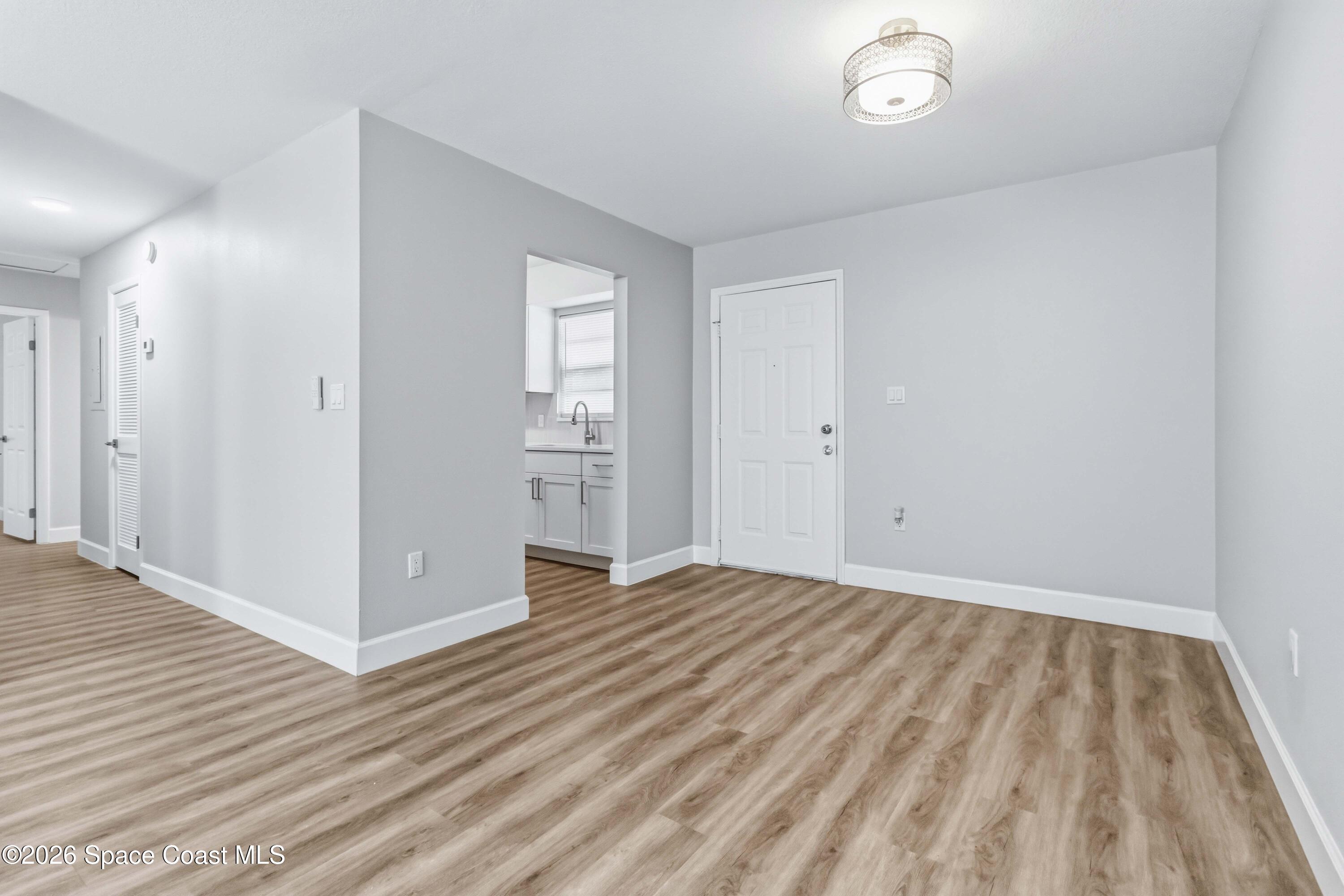 2258 Flower Tree Circle Melbourne, FL 32935 - Photo 6 of 30 a view of empty room with wooden floor