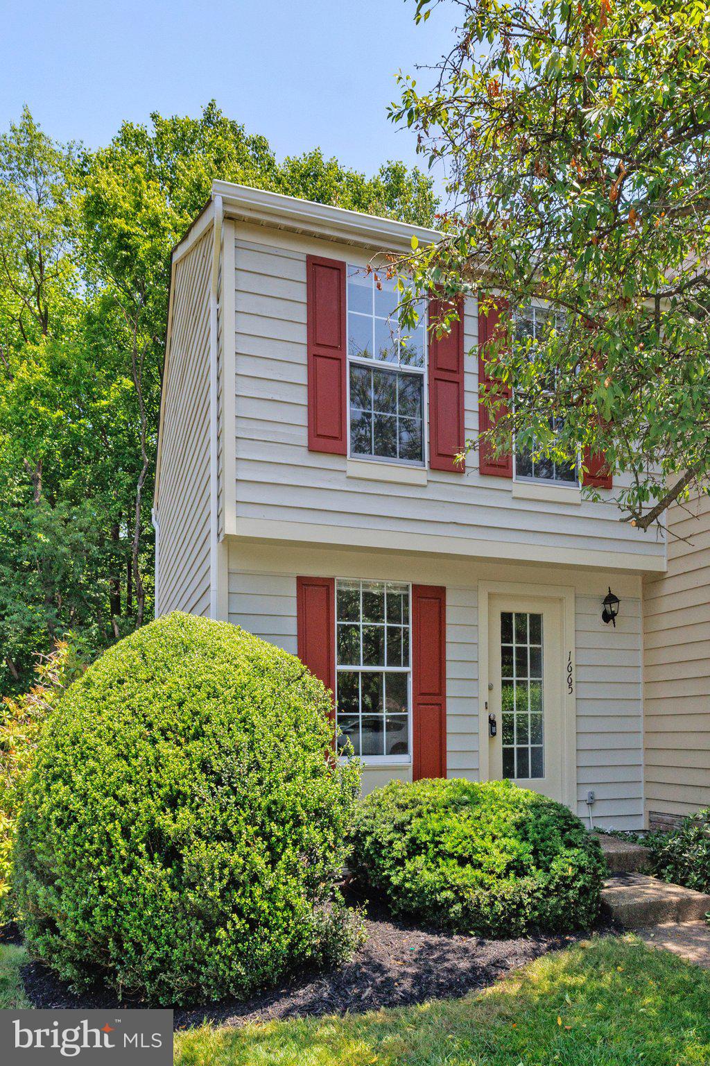 front view of a house with a yard