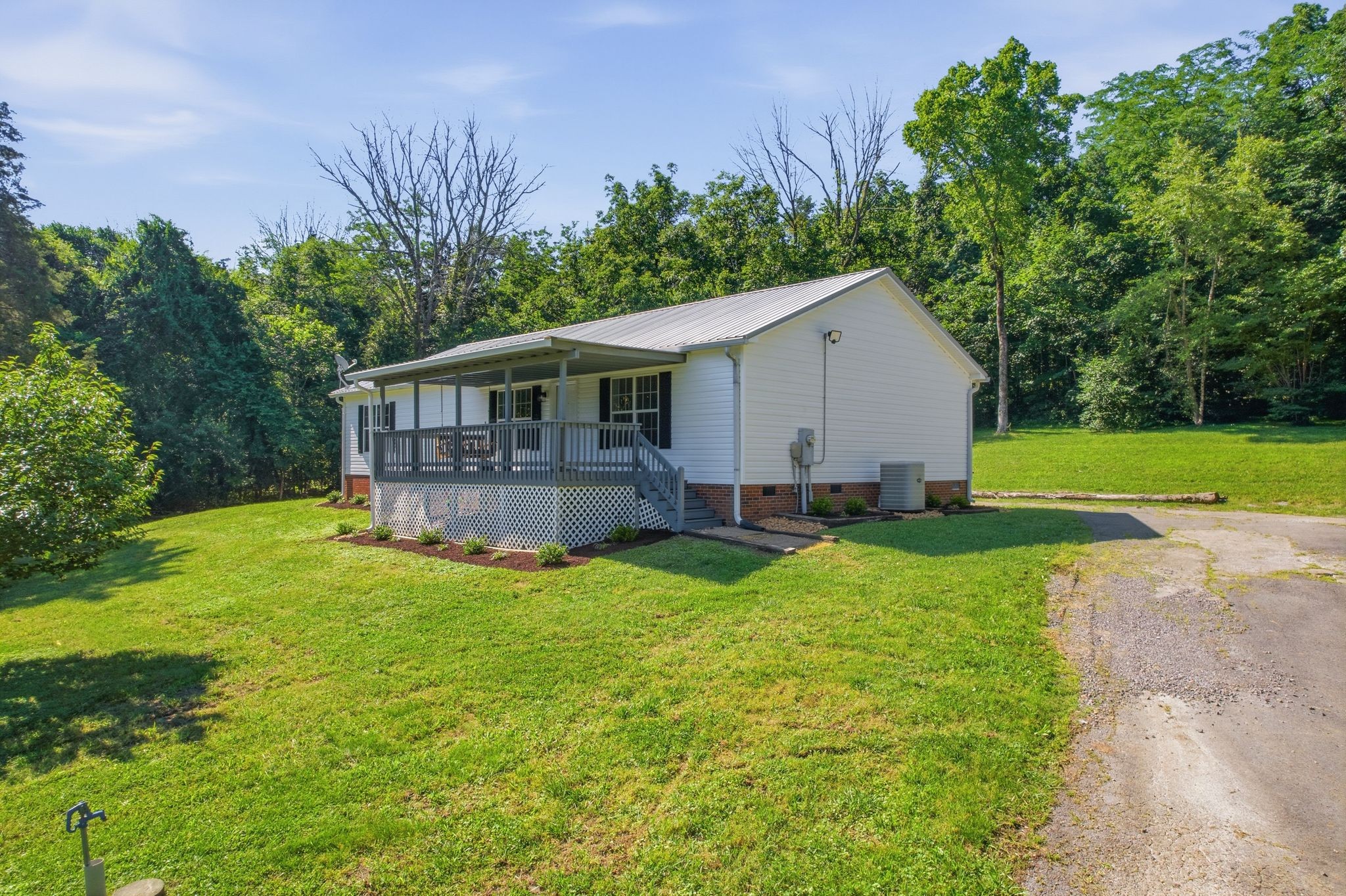 1021 B Jordan Road Lascassas, TN 37085 - Photo 11 of 58 a view of a house with backyard and sitting area