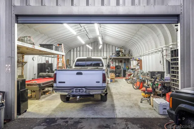 an aerial view of a house with a yard and a garden