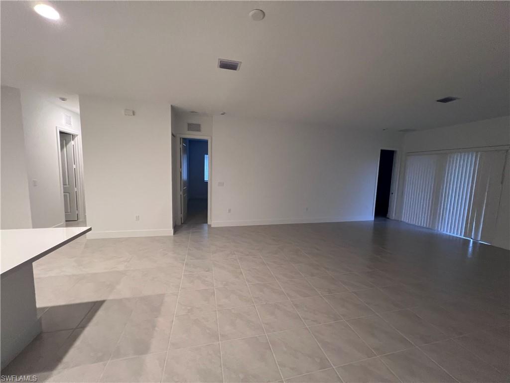 5261 Lamone Ln Avenue Immokalee, FL 34142 - Photo 14 of 14 Unfurnished living room featuring light tile patterned floors