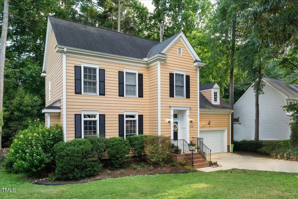 11905 Radner Way Raleigh, NC 27613 - Photo 2 of 35 a front view of a house with a yard and porch