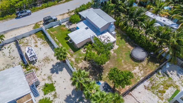 an aerial view of a house with outdoor space