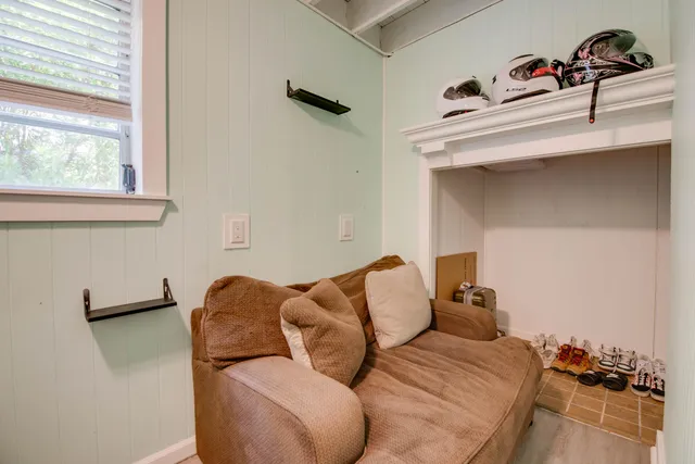 a bed room with a bed and a window