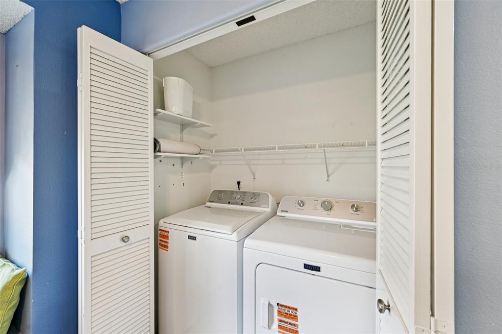 2215 Olive Branch Drive Sun City Center, FL 33573 - Photo 12 of 60 a utility room with dryer and washer
