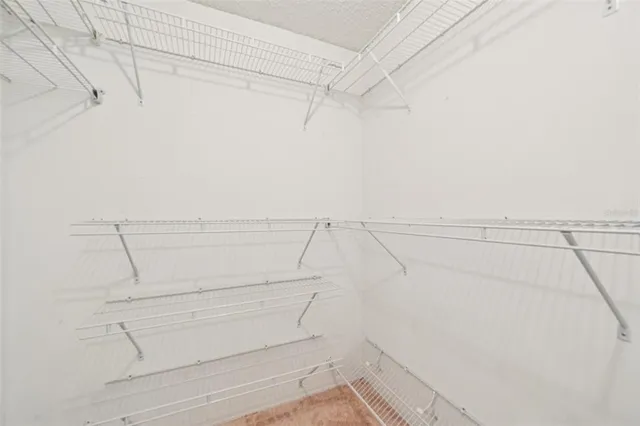 a workspace with wooden floor and a ceiling fan