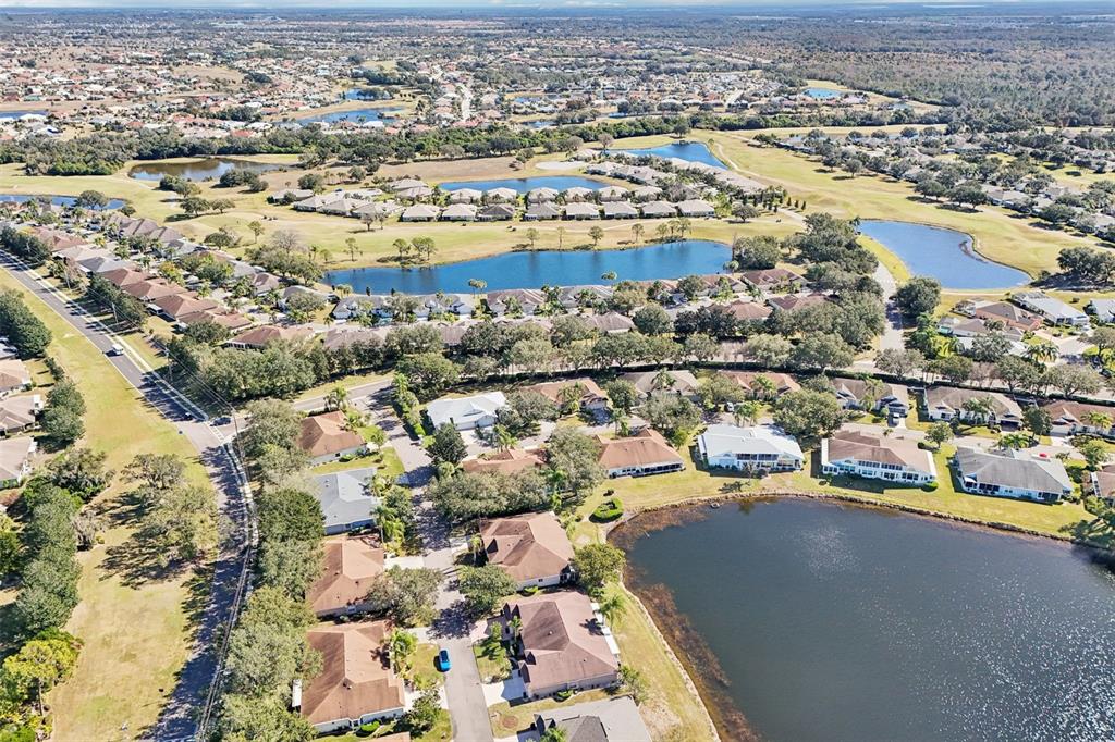 2215 Olive Branch Drive Sun City Center, FL 33573 - Photo 31 of 60 an aerial view of residential houses with outdoor space