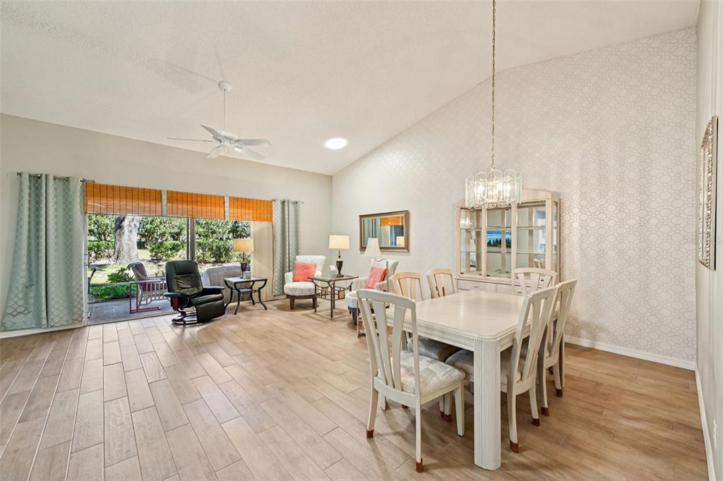 2215 Olive Branch Drive Sun City Center, FL 33573 - Photo 5 of 60 a view of a dining room with furniture window and outside view