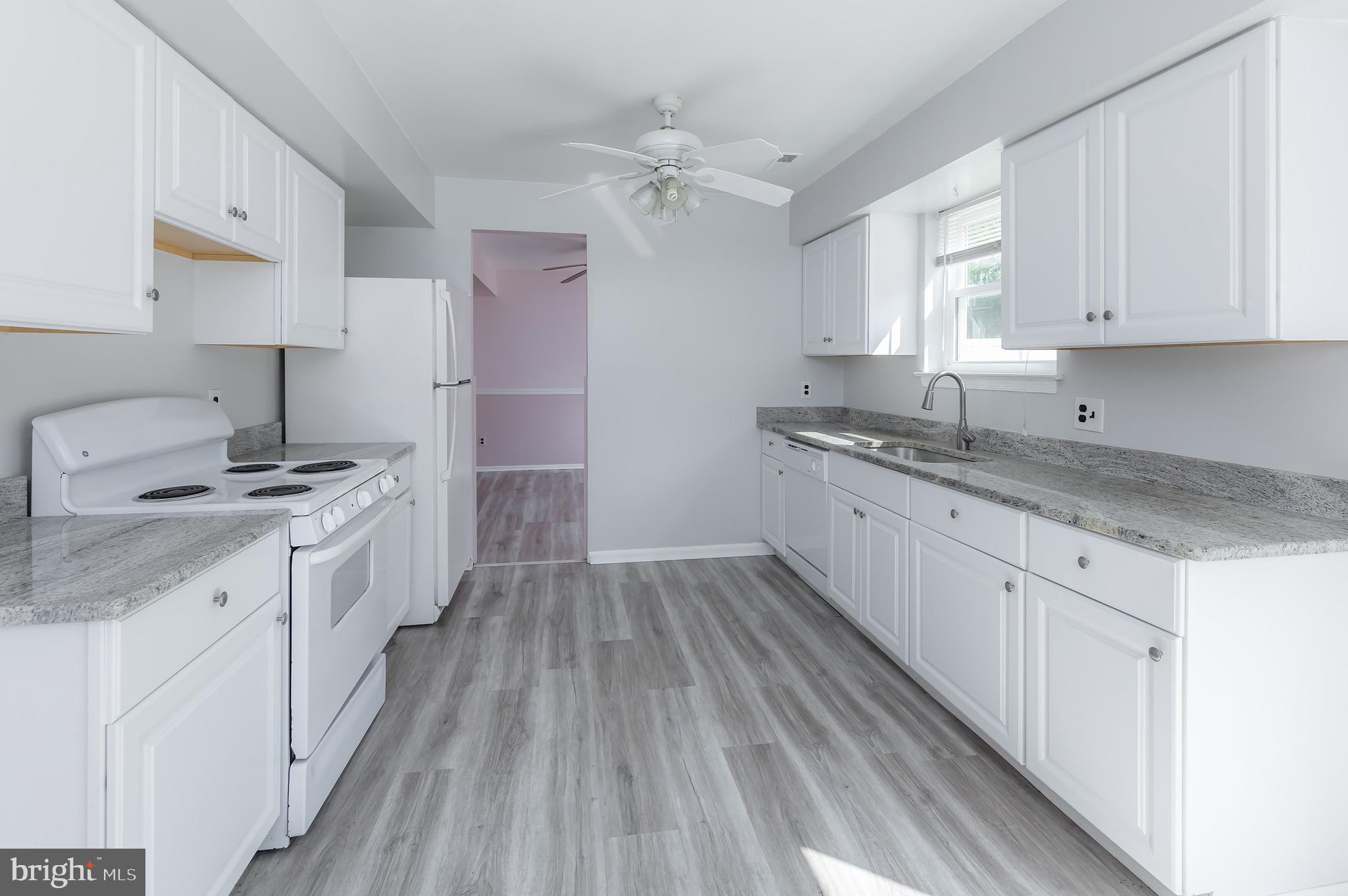 75 Hartford Road Sewell, NJ 08080 - Photo 12 of 23 a kitchen with a sink stove and cabinets