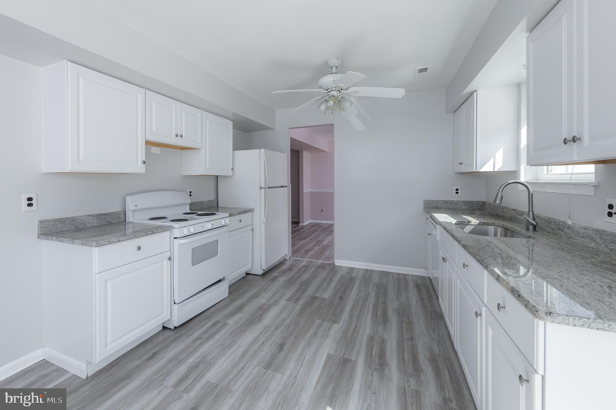 75 Hartford Road Sewell, NJ 08080 - Photo 13 of 23 a kitchen with granite countertop a sink cabinets stainless steel appliances and a counter space
