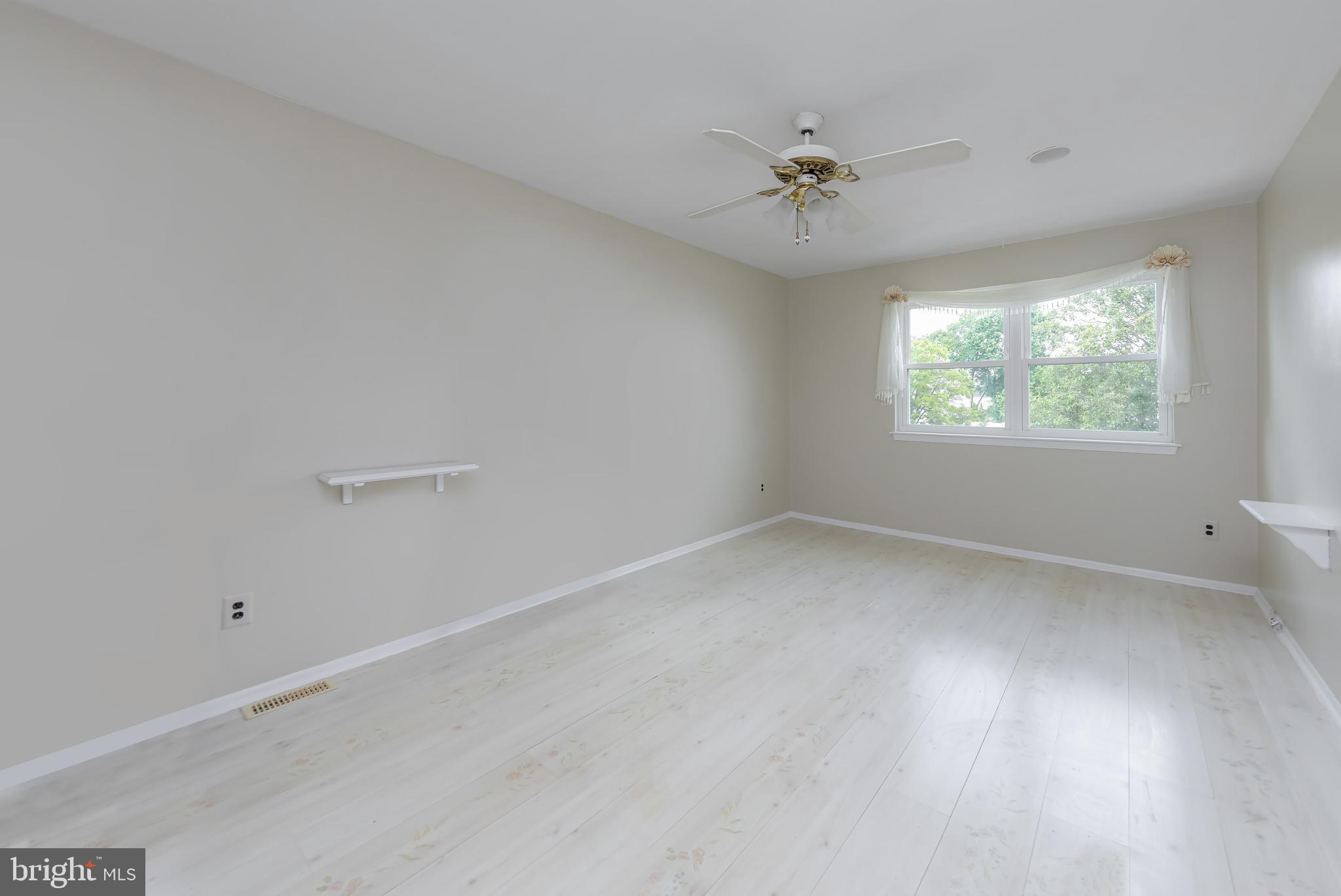 75 Hartford Road Sewell, NJ 08080 - Photo 19 of 23 an empty room with a window and a fan