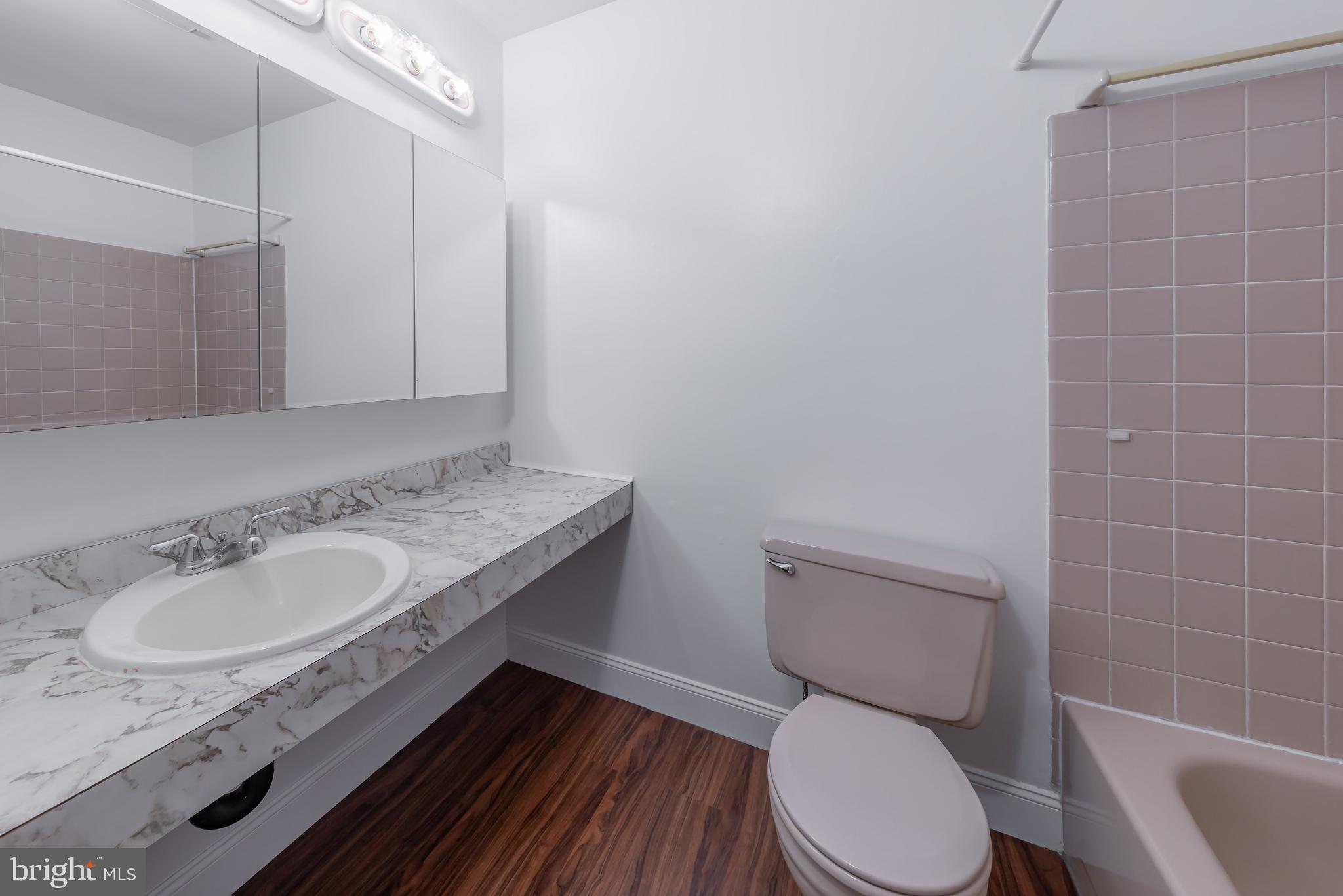 75 Hartford Road Sewell, NJ 08080 - Photo 20 of 23 a bathroom with a granite countertop sink a toilet a mirror and shower