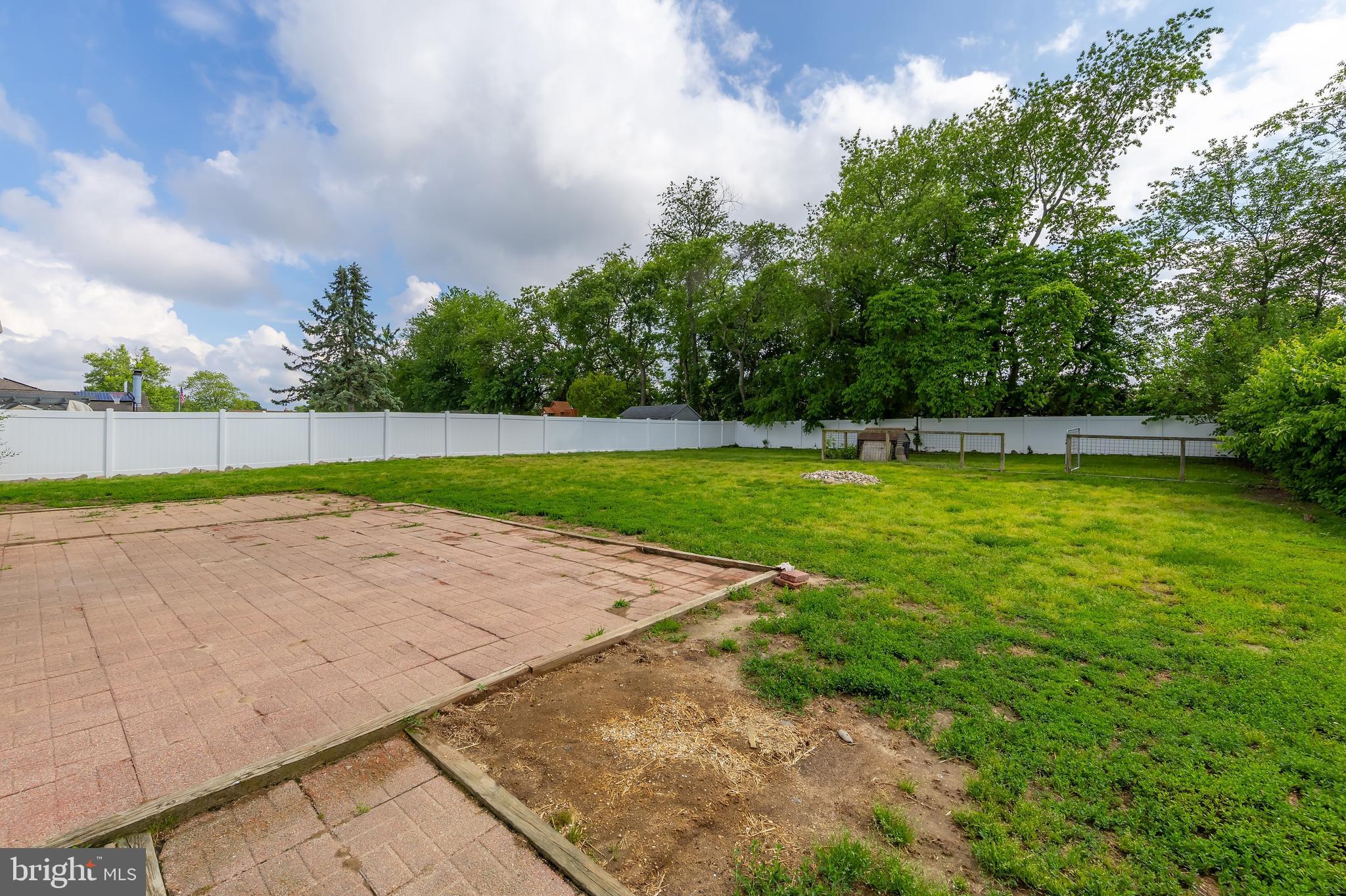 75 Hartford Road Sewell, NJ 08080 - Photo 4 of 23 a view of a swimming pool with a yard