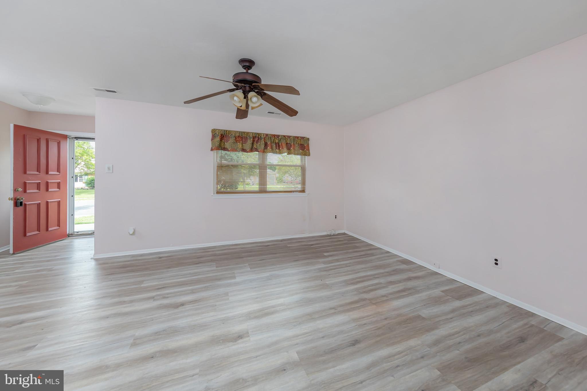 75 Hartford Road Sewell, NJ 08080 - Photo 8 of 23 wooden floor in an empty room with a window
