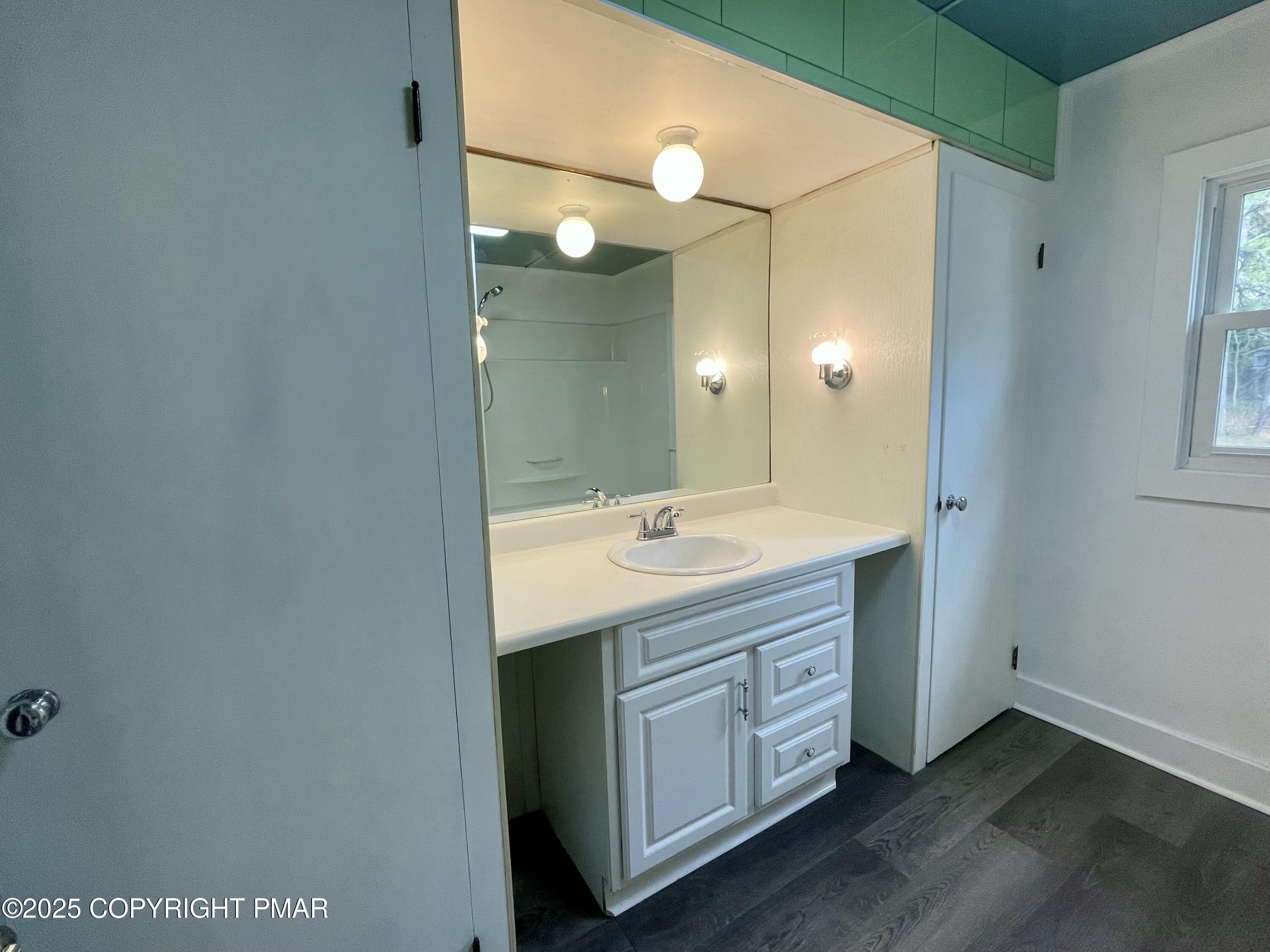 3284 Highway 115, Unit 1 Effort, PA 18330 - Photo 14 of 17 a spacious bathroom with a double vanity sink and a mirror