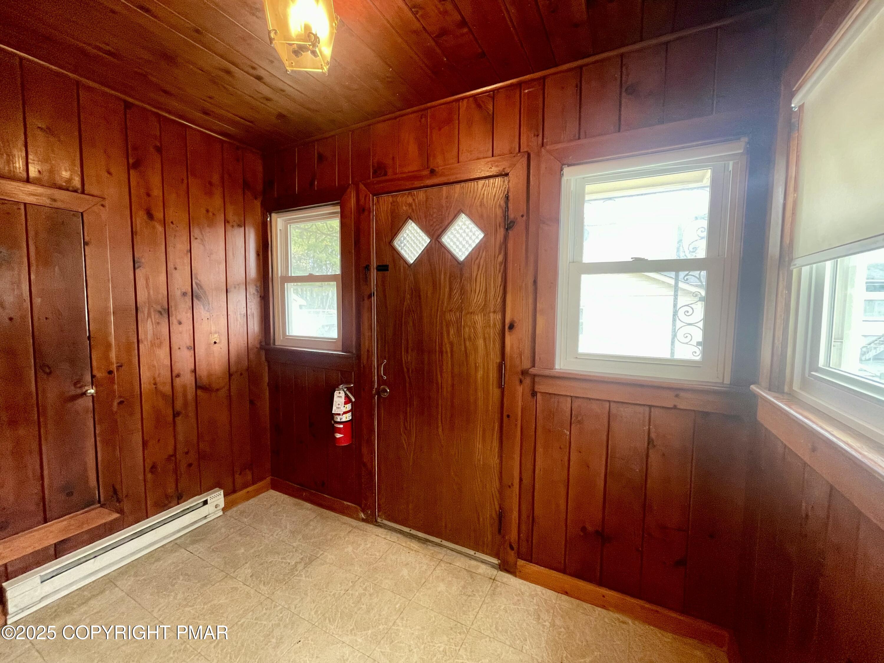 3284 Highway 115, Unit 1 Effort, PA 18330 - Photo 17 of 17 an empty room with windows closet and chandelier fan