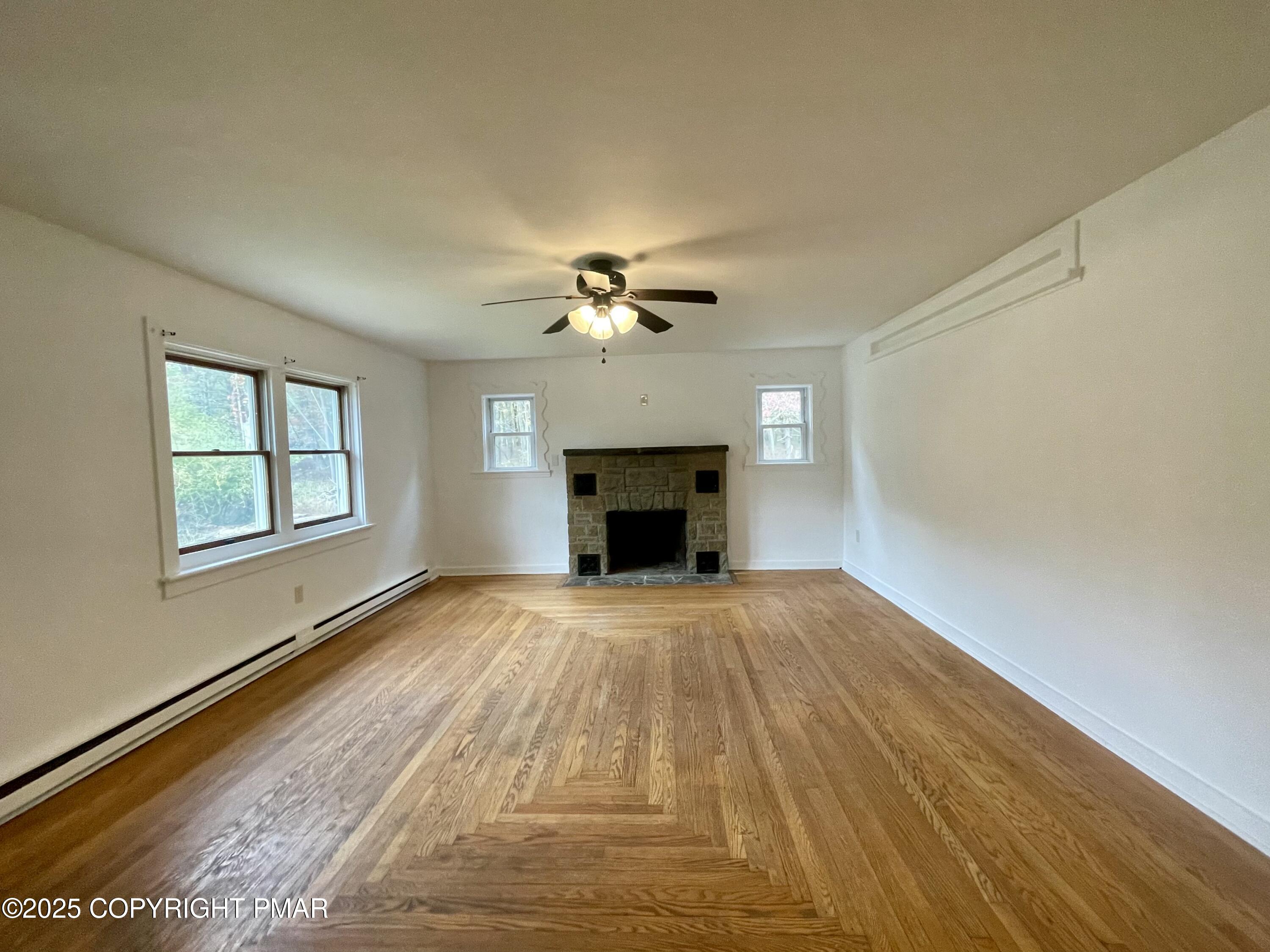 3284 Highway 115, Unit 1 Effort, PA 18330 - Photo 3 of 17 a view of an empty room with a fireplace and a window