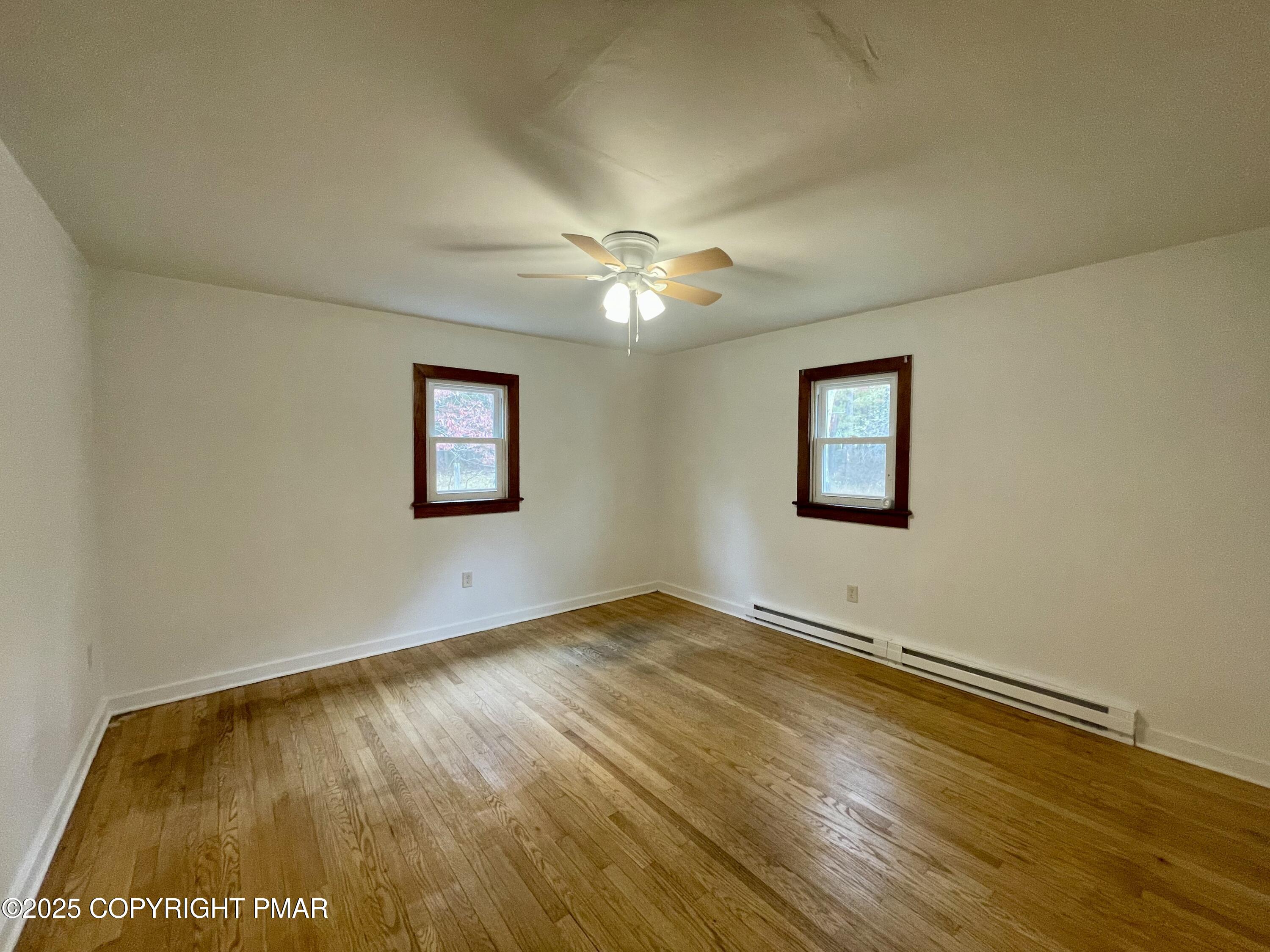 3284 Highway 115, Unit 1 Effort, PA 18330 - Photo 10 of 17 a view of an empty room with window and chandelier fan