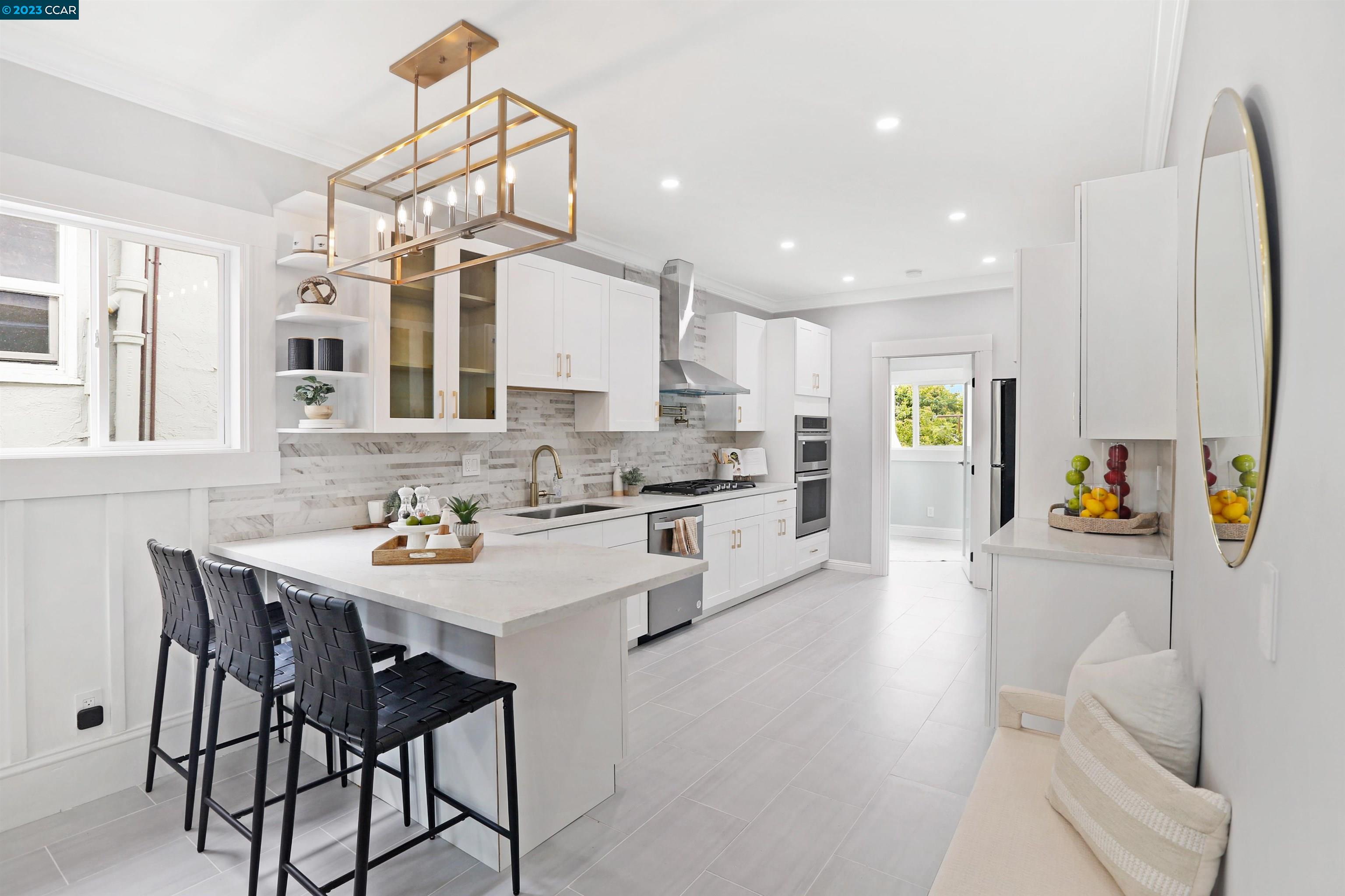 a kitchen with granite countertop white cabinets and counter space