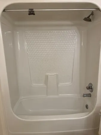 a close view of a bathtub in bathroom