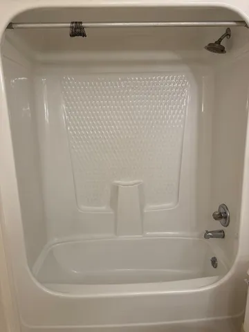 a close view of a bathtub in bathroom