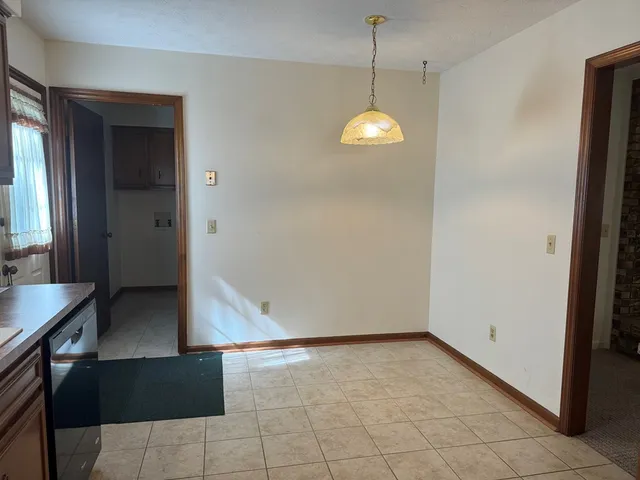 a view of a kitchen from the hallway