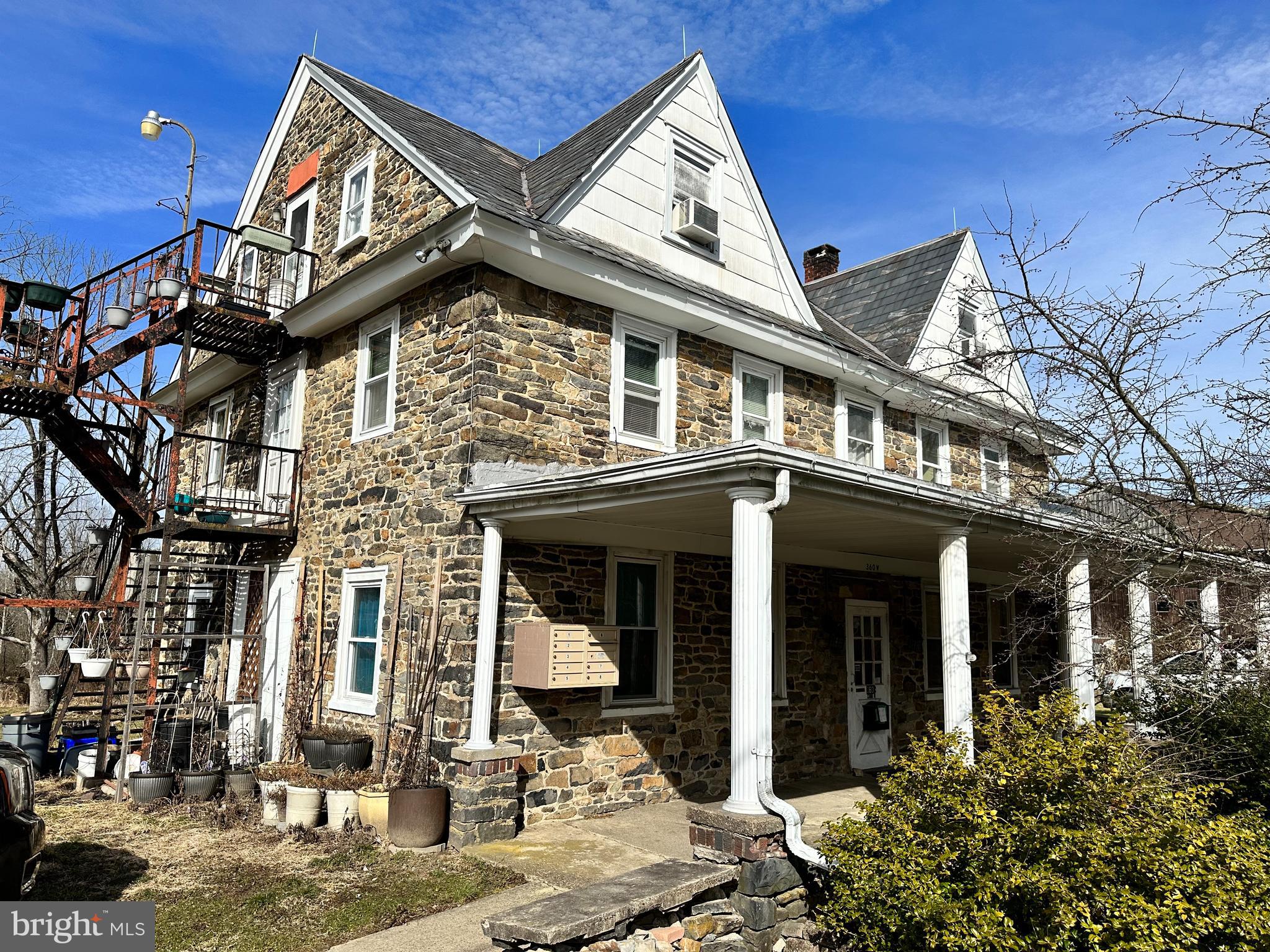 360 West Paletown Road, Unit 1R Quakertown, PA 18951 - Photo 1 of 6 front view of a house with a street
