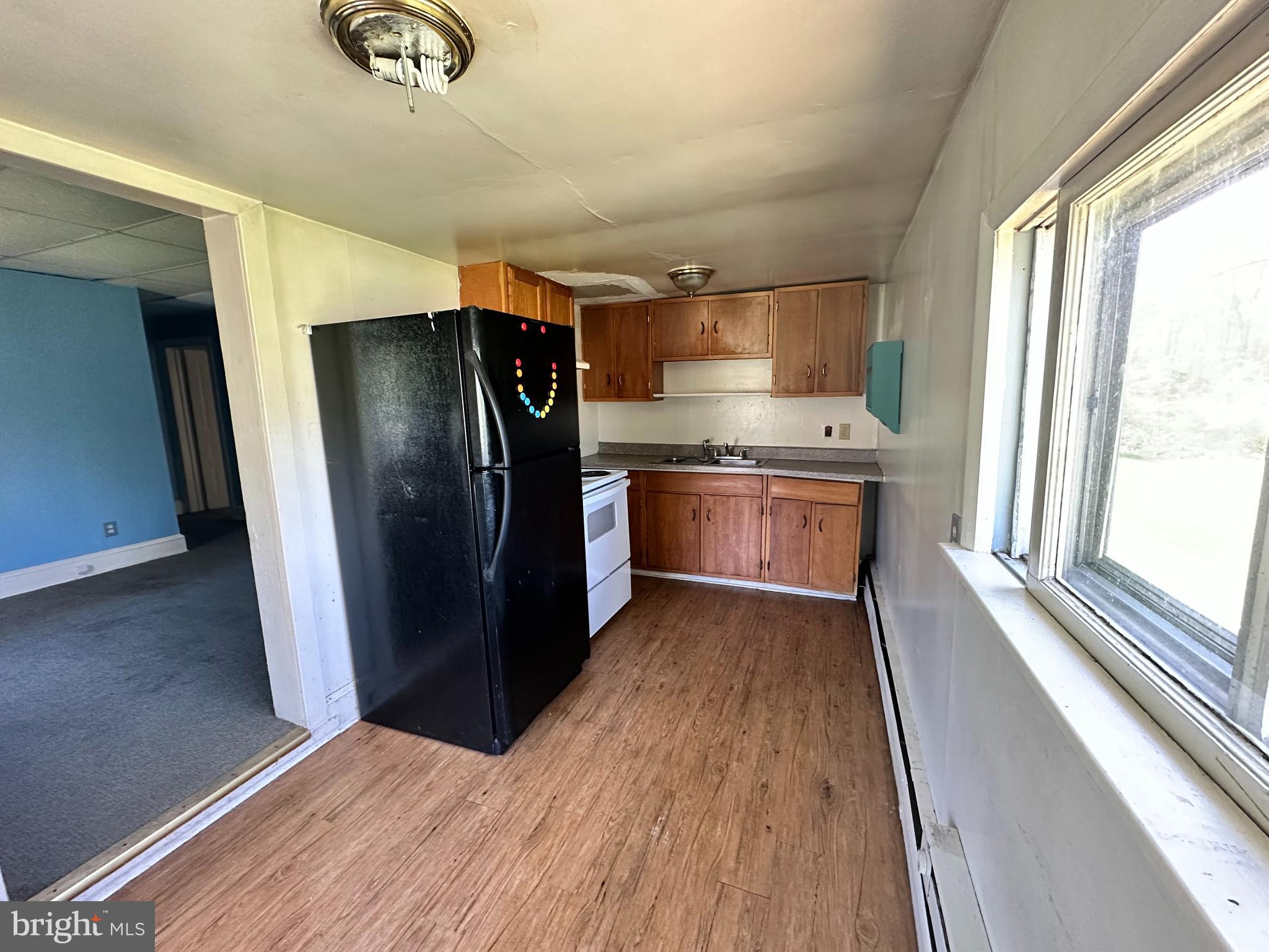 360 West Paletown Road, Unit 1R Quakertown, PA 18951 - Photo 2 of 6 a kitchen with stainless steel appliances granite countertop a refrigerator and a sink