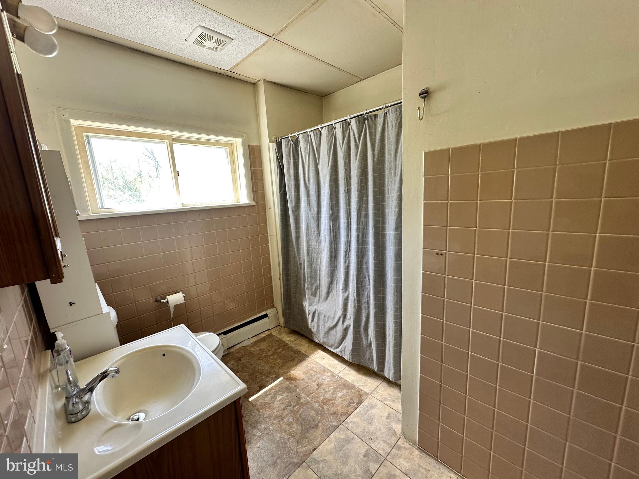 360 West Paletown Road, Unit 1R Quakertown, PA 18951 - Photo 6 of 6 a bathroom with a sink toilet and shower